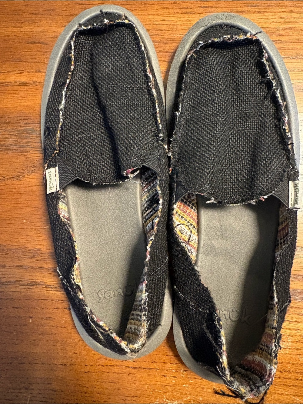 Sanuk women’s Black Canvas Slip-On Moccasins with Multi Accent Trim